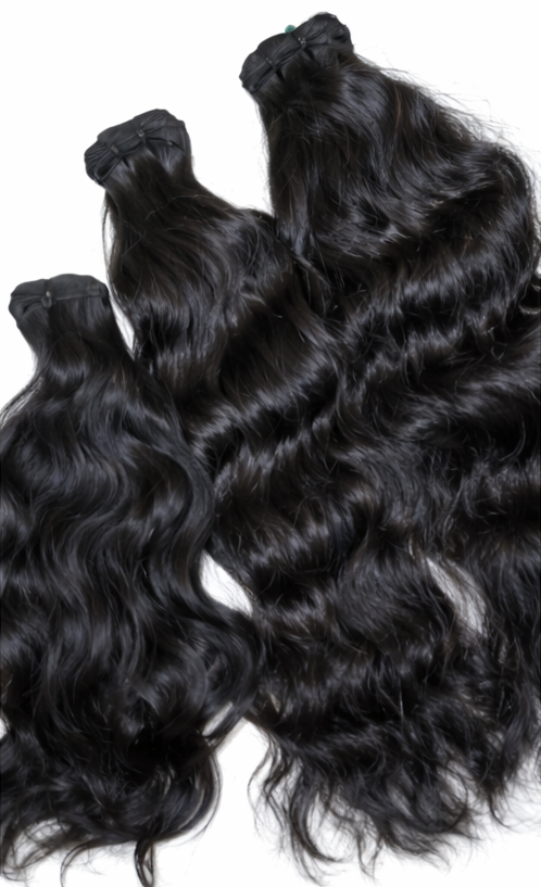 Three bundles of black indian wavy hair extensions 